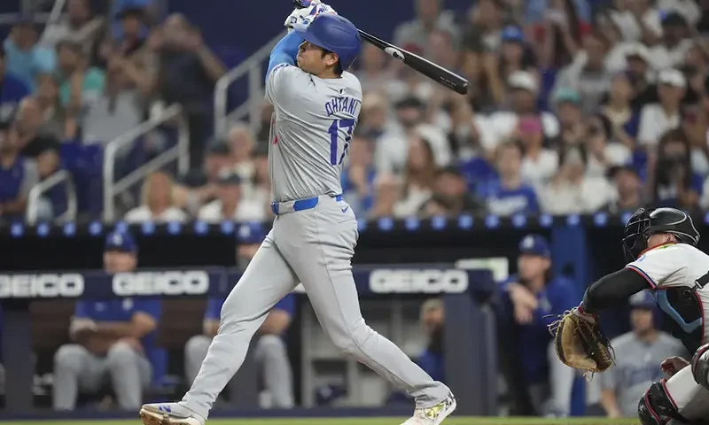 Los Angeles Dodgers designated hitter Shohei Ohtani (17) hits a two-run home run in the third inning against the Miami Marlins at loanDepot Park. Mandatory Credit: Jim Rassol-Imagn Images
