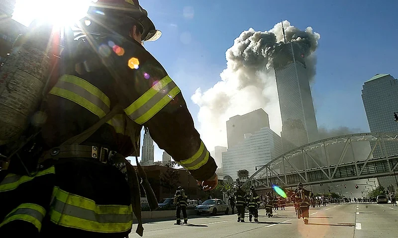 394263 12: (PUERTO RICO OUT) Firefighters walk towards one of the tower at the World Trade Center before it collapsed after a plane hit the building September 11, 2001 in New York City. (Photo by Jose Jimenez/Primera Hora/Getty Images)