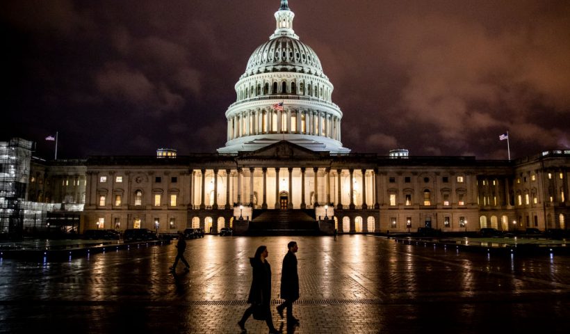 WASHINGTON, DC - DECEMBER 17: People walk along the east front plaza of the US Capitol as night falls on December 17, 2019 in Washington, DC. The House Rules Committee is holding a full committee hearing to set guidelines for the upcoming debate and vote on the two Articles of Impeachment of President Trump in the House of Representatives. (Photo by Samuel Corum/Getty Images)