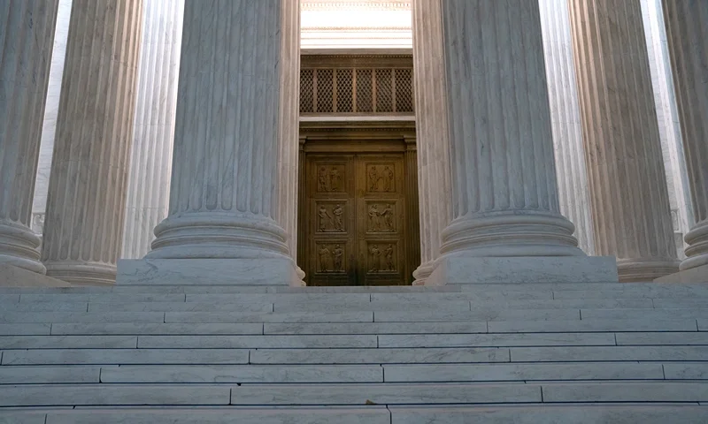 WASHINGTON, DC - OCTOBER 20: The doors to the Supreme Court in the early morning on October 20, 2020 in Washington, DC. The Supreme Court ruled on Monday that election officials in the state of Pennsylvania are allowed to count absentee ballots received after Election Day, as long as they are postmarked by November 3. (Photo by Stefani Reynolds/Getty Images)