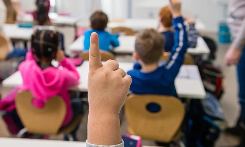 First graders of the 39th Dresden primary school sit in their classroom for the first lesson following the coronavirus lockdown in Dresden, eastern Germany, on February 15, 2021, amid the novel coronavirus / COVID-19 pandemic. - In the eastern federal state of Saxony, pre-schools and primary schools have started easing their restrictions implemented in order to curb the spread of the virus. (Photo by JENS SCHLUETER / AFP) (Photo by JENS SCHLUETER/AFP via Getty Images)