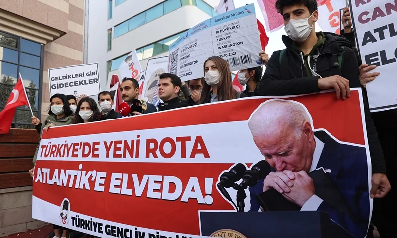 Members of the Youth Union of Turkey organisation (TGB) gather to support Turkish President's call to expel the ambassadors of 10 Western allies in front of the US embassy in Ankara, on October 25, 2021. - Turkey's relations with Western allies edged on October 25 toward their deepest crisis of President Recep Tayyip Erdogan's 19-year rule, as world capitals braced for Ankara's possible expulsion of ambassadors from the US and nine other countries. (Photo by Adem ALTAN / AFP) (Photo by ADEM ALTAN/AFP via Getty Images)