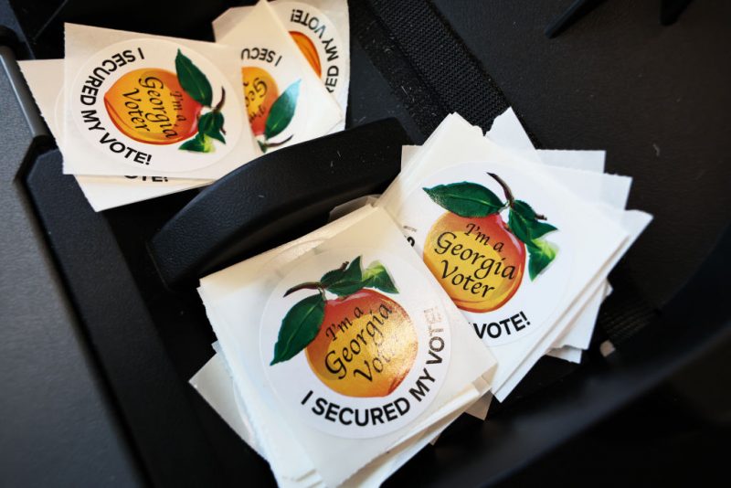 ATLANTA, GEORGIA - NOVEMBER 04: Voting stickers are seen as people cast their ballot during early voting for the midterm elections at Ponce De Leon Library on November 04, 2022 in Atlanta, Georgia. Long lines were seen at several polling locations in Atlanta as early voting is underway ahead of Tuesday's midterm elections, where Georgians will be voting for the state's next governor and senator. (Photo by Michael M. Santiago/Getty Images)