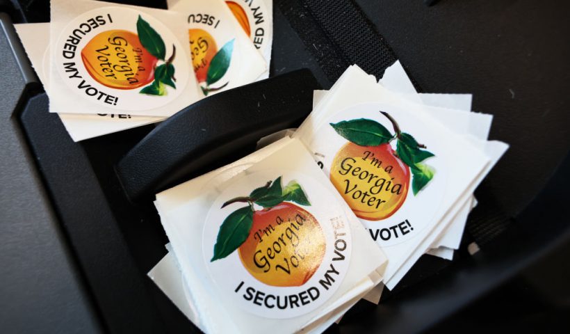 ATLANTA, GEORGIA - NOVEMBER 04: Voting stickers are seen as people cast their ballot during early voting for the midterm elections at Ponce De Leon Library on November 04, 2022 in Atlanta, Georgia. Long lines were seen at several polling locations in Atlanta as early voting is underway ahead of Tuesday's midterm elections, where Georgians will be voting for the state's next governor and senator. (Photo by Michael M. Santiago/Getty Images)