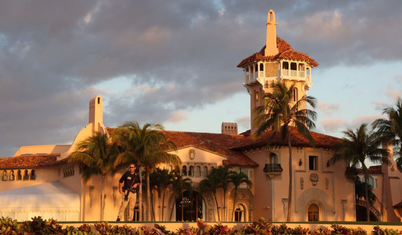 PALM BEACH, FLORIDA - MARCH 21: A Secret Service agent guards the Mar-a-Lago home of former President Donald Trump on March 21, 2023 in Palm Beach, Florida. Trump said on a social media post that he expects to be arrested in connection with an investigation into a hush-money scheme involving adult film actress Stormy Daniels and called on his supporters to protest any such move. However, it is unclear if he will be arrested or not. (Photo by Joe Raedle/Getty Images)