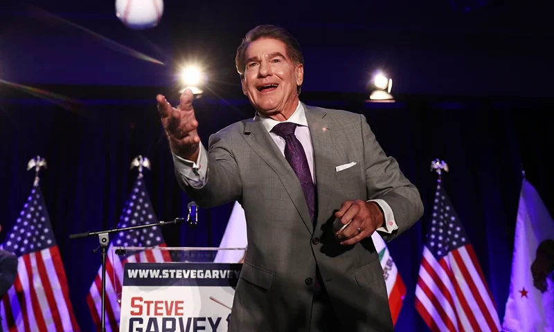Republican Senate candidate Steve Garvey, a former Los Angeles Dodgers baseball player, tosses a baseball to supporters at his election night watch party on March 5, 2024 in Palm Desert, California. Garvey and Democratic Senate candidate U.S. Rep. Adam Schiff (D-CA) are projected to win the ‘jungle primary’ for a California U.S. Senate seat. Democrats and Republicans are voting in 15 states on Super Tuesday. (Photo by Mario Tama/Getty Images)