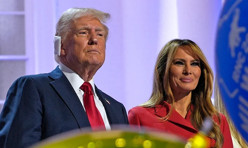 Former US President and 2024 Republican presidential candidate Donald Trump is joined by former US First Lady Melania Trump after accepting his party's nomination at the end of the last day of the 2024 Republican National Convention at the Fiserv Forum in Milwaukee, Wisconsin, on July 18, 2024. Donald Trump will get a hero's welcome Thursday as he accepts the Republican Party's nomination to run for US president in a speech capping a convention dominated by the recent attempt on his life. (Photo by Nick Oxford / AFP) (Photo by NICK OXFORD/AFP via Getty Images)