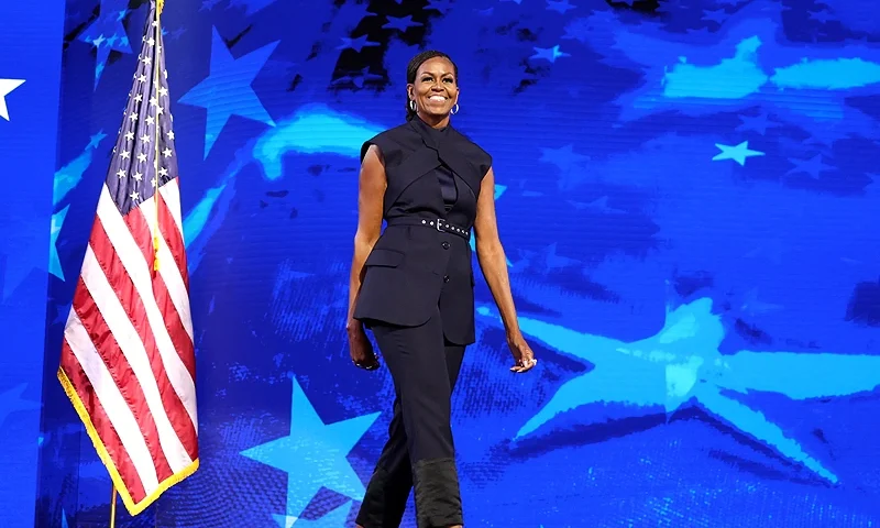 TOPSHOT - Former US First Lady Michelle Obama arrives to speak on the second day of the Democratic National Convention (DNC) at the United Center in Chicago, Illinois, on August 20, 2024. Vice President Kamala Harris will formally accept the party's nomination for president at the DNC which runs from August 19-22 in Chicago. (Photo by CHARLY TRIBALLEAU / AFP) (Photo by CHARLY TRIBALLEAU/AFP via Getty Images)