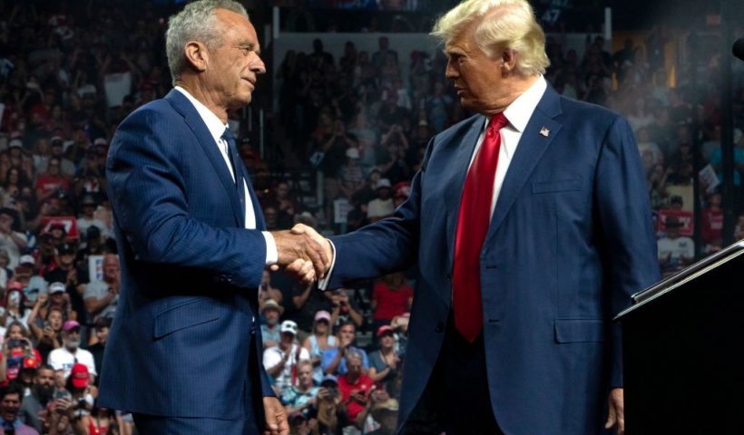 GLENDALE, ARIZONA - AUGUST 23: Former Republican presidential candidate Robert F. Kennedy Jr. and Republican presidential nominee, former U.S. President Donald Trump shake hands during a campaign rally at Desert Diamond Arena on August 23, 2024 in Glendale, Arizona. Kennedy announced today that he was suspending his presidential campaign and supporting former President Trump. (Photo by Rebecca Noble/Getty Images)