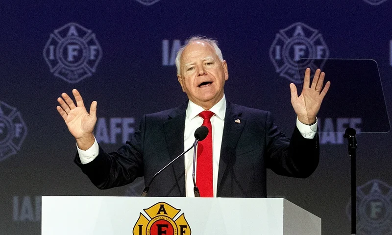 BOSTON, MASSACHUSETTS - AUGUST 28: Democratic vice presidential nominee, Minnesota Gov. Tim Walz speaks on stage during the International Association of Fire Fighters (IAFF) Convention on August 28, 2024 in Boston, Massachusetts. Gov. Walz is set to join his Democratic running mate, Vice President Kamala Harris, on a bus tour in Georgia. (Photo by Scott Eisen/Getty Images)