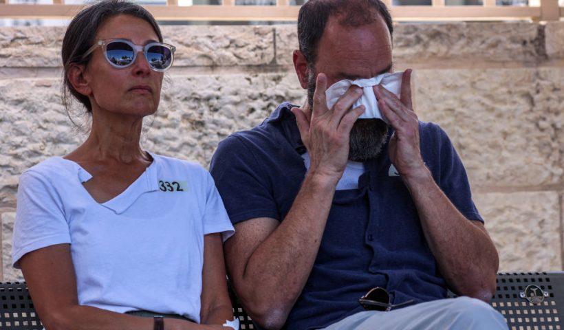 Jonathan Polin and Rachel Goldberg, parents of killed US-Israeli hostage Hersh Goldberg-Polin whose body was recovered with five other hostages in Gaza, react during the funeral in Jerusalem on September 2, 2024, amid the ongoing conflict between Israel and the Palestinian militant group Hamas. The six were among 251 hostages seized during Hamas's October 7 attack that triggered the ongoing war between Israel and Hamas. (Photo by GIL COHEN-MAGEN / POOL / AFP) (Photo by GIL COHEN-MAGEN/POOL/AFP via Getty Images)