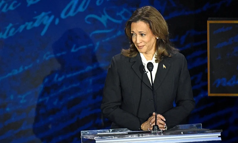 TOPSHOT - US Vice President and Democratic presidential candidate Kamala Harris listens as former US President and Republican presidential candidate Donald Trump speaks during a presidential debate at the National Constitution Center in Philadelphia, Pennsylvania, on September 10, 2024. (Photo by SAUL LOEB / AFP) (Photo by SAUL LOEB/AFP via Getty Images)