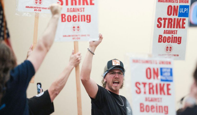 TOPSHOT - Union members react as Aerospace Machinists District 751 President Jon Holden (out of frame) announces that union members rejected a proposed Boeing contract and will go on strike, following voting results at their union hall in Seattle, Washington, on September 12, 2024. Boeing workers in the Seattle region overwhelmingly voted to strike on September 12, rejecting a contract the embattled aviation giant characterized as a boon for staff given the company's stressed financial condition. (Photo by Jason Redmond / AFP) (Photo by JASON REDMOND/AFP via Getty Images)