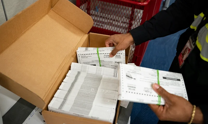 RALEIGH, NORTH CAROLINA - SEPTEMBER 17: Absentee ballots are prepared to be mailed at the Wake County Board of Elections on September 17, 2024 in Raleigh, North Carolina. North Carolina will send out absentee ballots to military and overseas citizens by September 20. Other absentee ballots will be sent by September 24 to voters who requested ballots by mail. Early voting begins October 17. (Photo by Allison Joyce/Getty Images)
