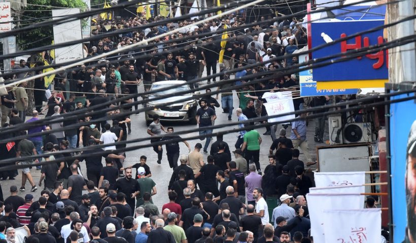 People react after a reported device explosion occurred during the funeral of people killed when hundreds of paging devices exploded in a deadly wave across Lebanon the previous day, in Beirut's southern suburbs on September 18, 2024. A second wave of device explosions killed three people in Hezbollah strongholds of Lebanon on September 18, raising fears of an all-out war between Israel and the Iran-backed militants. (Photo by Fadel ITANI / AFP) (Photo by FADEL ITANI/AFP via Getty Images)