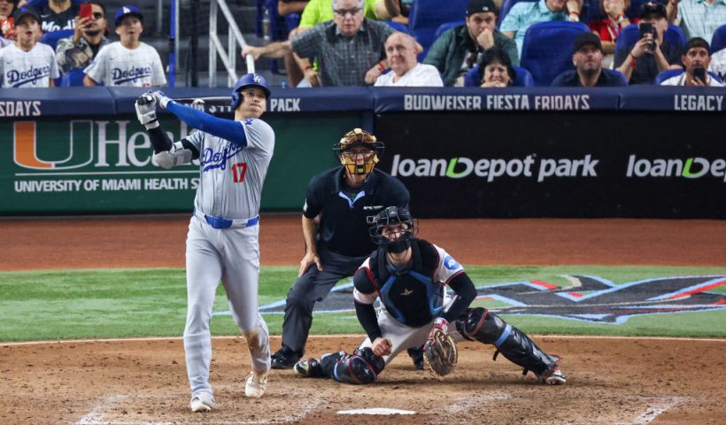 MIAMI, FLORIDA - SEPTEMBER 19: Shohei Ohtani #17 of the Los Angeles Dodgers hits a home run against the Miami Marlins during the seventh inning of the game at loanDepot park on September 19, 2024 in Miami, Florida. Ohtani is now the first MLB player to have at least 50 home runs and 50 stolen bases in the same season. (Photo by Chris Arjoon/Getty Images)