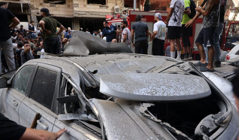 People check the damage following an Israeli strike in Beirut's southern suburbs on September 20, 2024. The Israeli military announced that the commander of Hezbollah's elite Radwan unit, Ibrahim Aqil, and other senior figures of the Lebanese armed group had been killed in the air strike. (Photo by ANWAR AMRO / AFP) (Photo by ANWAR AMRO/AFP via Getty Images)