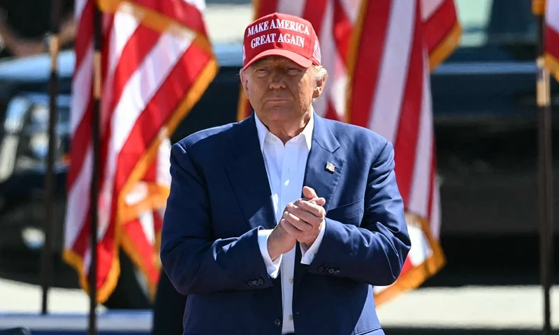 Former US President and Republican presidential candidate Donald Trump arrives onstage to speak during a campaign rally at the Aero Center in Wilmington, North Carolina, September 21, 2024. (Photo by Jim WATSON / AFP) (Photo by JIM WATSON/AFP via Getty Images)