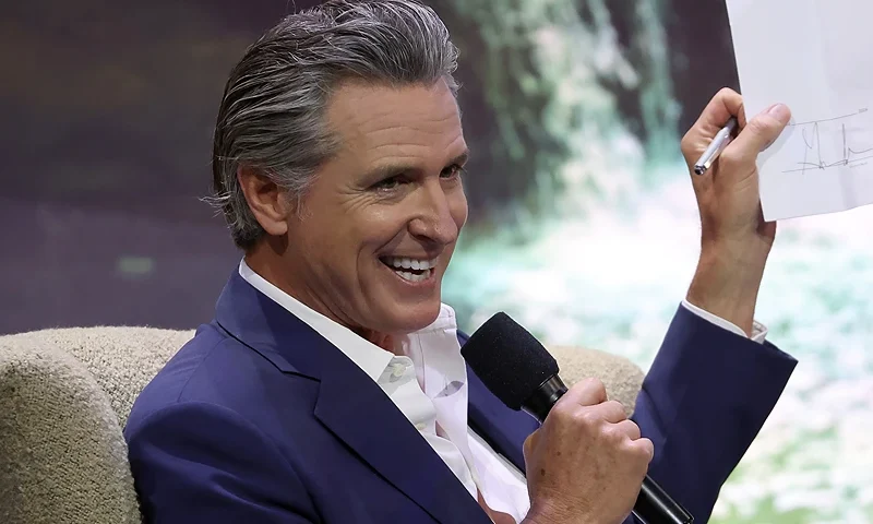 SAN FRANCISCO, CALIFORNIA - SEPTEMBER 17: California Gov. Gavin Newsom (L) talks onstage with Salesforce CEO Marc Benioff (R) during Salesforce's Dreamforce on September 17, 2024 in San Francisco, California. Some 45,000 workers in the tech industry were expected to attend the annual Dreamforce event, which runs through September 19. (Photo by Justin Sullivan/Getty Images)