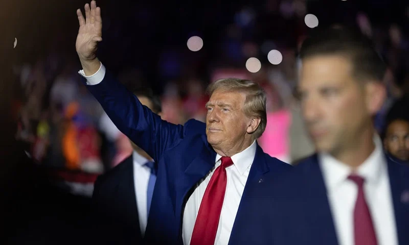 FLINT, MICHIGAN - SEPTEMBER 17: Republican presidential nominee, former U.S. President Donald Trump arrives for a campaign event, his first since a man carrying a rifle was arrested Sunday near where Trump was playing golf at his club in Florida, in the Dort Financial Center on September 17, 2024 in Flint, Michigan. Trump was playing an unscheduled game with real estate developer Steve Witkoff at the Trump International Golf Club in West Palm Beach when the man was spotted by security. (Photo by Scott Olson/Getty Images)