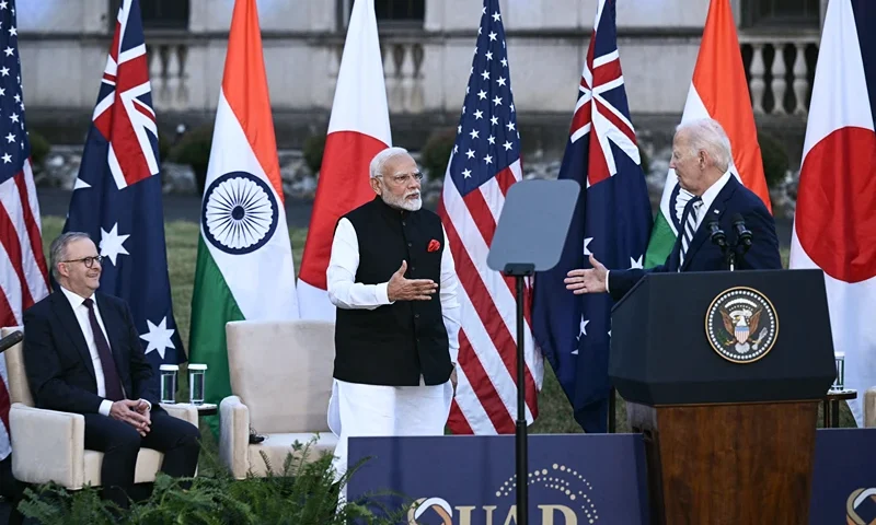 US President Joe Biden (R) introduces Indian Prime Minister Narendra Modi to speak as Australian Prime Minister Anthony Albanese (L) looks on during an event about the Quadrilateral Cancer Moonshot during the Quadrilateral Summit at the Archmere Academy in Wilmington, Delaware, on September 21, 2024. (Photo by Brendan SMIALOWSKI / AFP) (Photo by BRENDAN SMIALOWSKI/AFP via Getty Images)