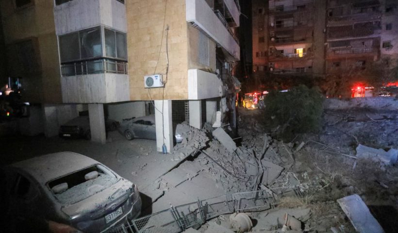 This picture shows damaged cars and buildings following an Israeli air strike in the Haret Hreik neighbourhood of Beirut's southern suburbs on September 27, 2024. Israel carried out air strikes on the south of Lebanon's capital Beirut on September 27 that it said targeted Hezbollah's headquarters, moments after Prime Minister Benjamin Netanyahu vowed to keep fighting the militant group. (Photo by AFP) (Photo by -/AFP via Getty Images)