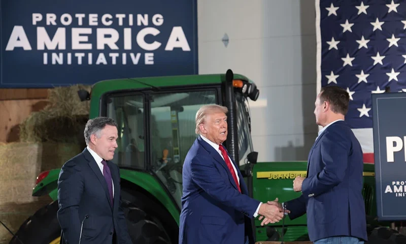 SMITHTON, PENNSYLVANIA - SEPTEMBER 23: Republican presidential nominee, former U.S. President Donald Trump, (C) looks on during a campaign stop to address Pennsylvanians who are concerned about the threat of Communist China to U.S. agriculture at the Smith Family Farm September 23, 2024 in Smithton, Pennsylvania. Trump is campaigning throughout western Pennsylvania today. (Photo by Win McNamee/Getty Images)
