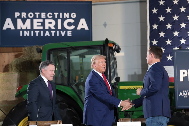 SMITHTON, PENNSYLVANIA - SEPTEMBER 23: Republican presidential nominee, former U.S. President Donald Trump, (C) looks on during a campaign stop to address Pennsylvanians who are concerned about the threat of Communist China to U.S. agriculture at the Smith Family Farm September 23, 2024 in Smithton, Pennsylvania. Trump is campaigning throughout western Pennsylvania today. (Photo by Win McNamee/Getty Images)