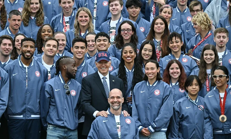 US President Joe Biden poses for a photo with athletes during an event celebrating the 2024 US Olympic and Paralympic teams on the South Lawn of the White House in Washington, DC, September 30, 2024. (Photo by ANDREW CABALLERO-REYNOLDS / AFP) (Photo by ANDREW CABALLERO-REYNOLDS/AFP via Getty Images)