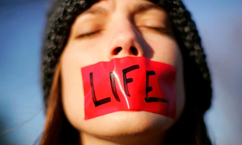 WASHINGTON - NOVEMBER 30: Pro-life activist Lynn Jackson, with the group Bound for Life, protests in front of the U.S. Supreme Court November 30, 2005 in Washington, DC. The highest court in the U.S. is hearing the first case on abortion rights since Chief Justice John Roberts was sworn in.. (Photo by Win McNamee/Getty Images)