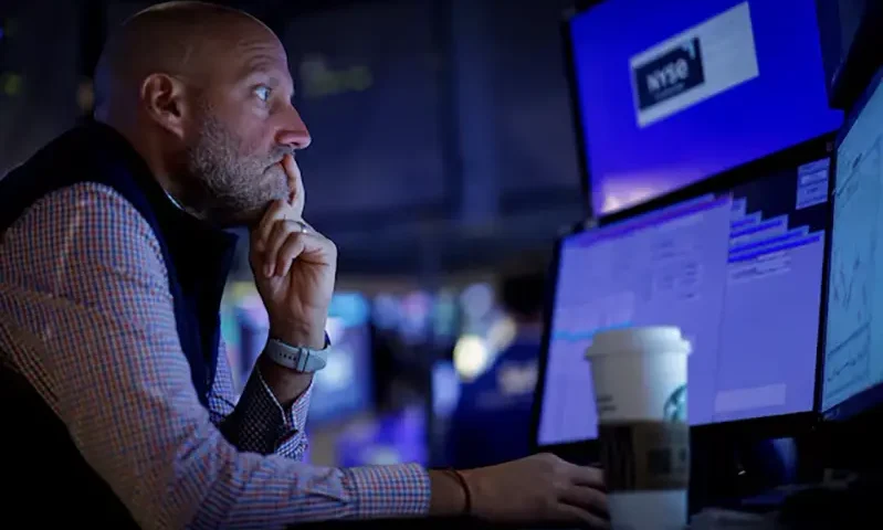 A specialist trader works inside a post on the floor at the New York Stock Exchange (NYSE) in New York City, U.S., September 9, 2024. REUTERS/Brendan McDermid/File Photo
