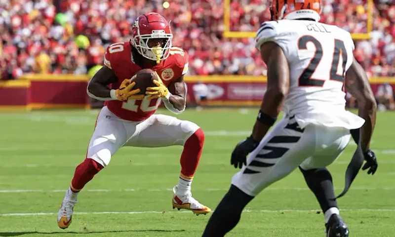 Kansas City Chiefs running back Isiah Pacheco (10) catches a pass against Cincinnati Bengals safety Vonn Bell (24) at GEHA Field at Arrowhead Stadium. Mandatory Credit: Jay Biggerstaff-Imagn Images