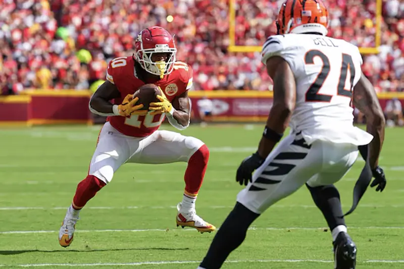 Kansas City Chiefs running back Isiah Pacheco (10) catches a pass against Cincinnati Bengals safety Vonn Bell (24) at GEHA Field at Arrowhead Stadium. Mandatory Credit: Jay Biggerstaff-Imagn Images