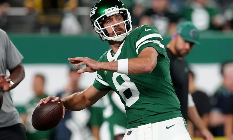 New York Jets quarterback Aaron Rodgers (8) warms up before a game against the New England Patriots at MetLife Stadium. Mandatory Credit: Brad Penner-Imagn Images