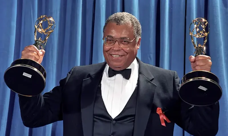 James Earl Jones holds up the two Emmy Awards he won won for Outstanding Lead Actor in a Drama Series for "Gabriel's Fire", and Outstanding Supporting Actor in a Mini-Series or Special for the TNT movie "Heat Wave" in Los Angeles, 1991. REUTERS/Mircovich/File Photo