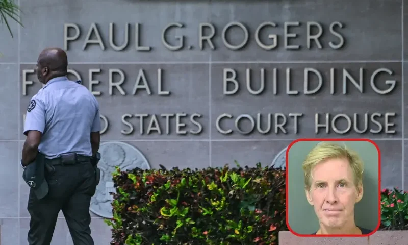 A police officer stands watch outside the Paul G. Rogers Federal Building and US Courthouse during a hearing on the detention of Ryan Wesley Routh, suspected of the attempted assassination of former US president Donald Trump, in West Palm Beach, Florida, on September 30, 2024. Ryan Wesley Routh, 58, was charged with possession of a firearm as a convicted felon and possession of a firearm with an obliterated serial number at his initial court appearance. (Photo by Giorgio VIERA / AFP) (Photo by GIORGIO VIERA/AFP via Getty Images)