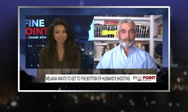 Video still from Fine Point on One America News Network showing a split screen of the host on the left side, and on the right side is the guest, Lee Smith.