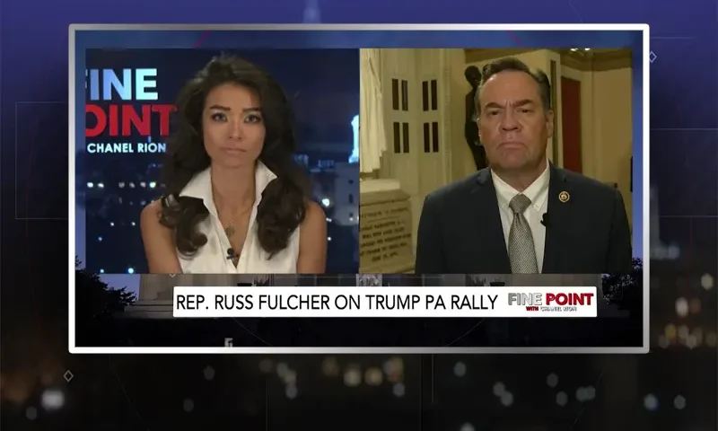Video still from Fine Point on One America News Network showing a split screen of the host on the left side, and on the right side is the guest, Russ Fulcher.