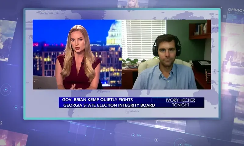 Video still from Ivory Hecker Tonight on One America News Network showing a split screen of the host on the left side, and on the right side is the guest, Chris Talgo.