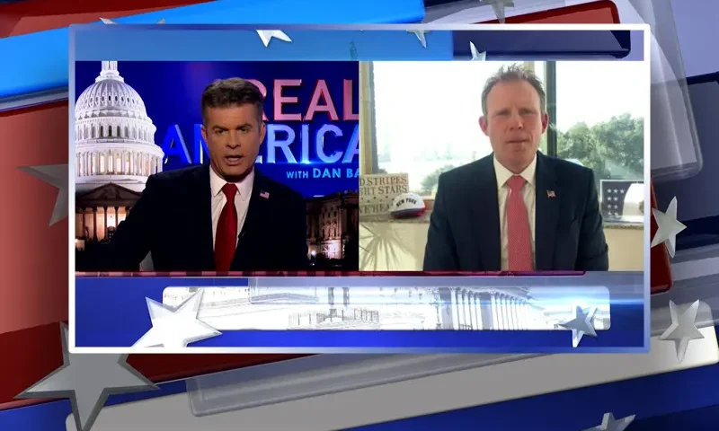 Video still from Real America on One America News Network showing a split screen of the host on the left side, and on the right side is the guest, Andrew Giuliani.