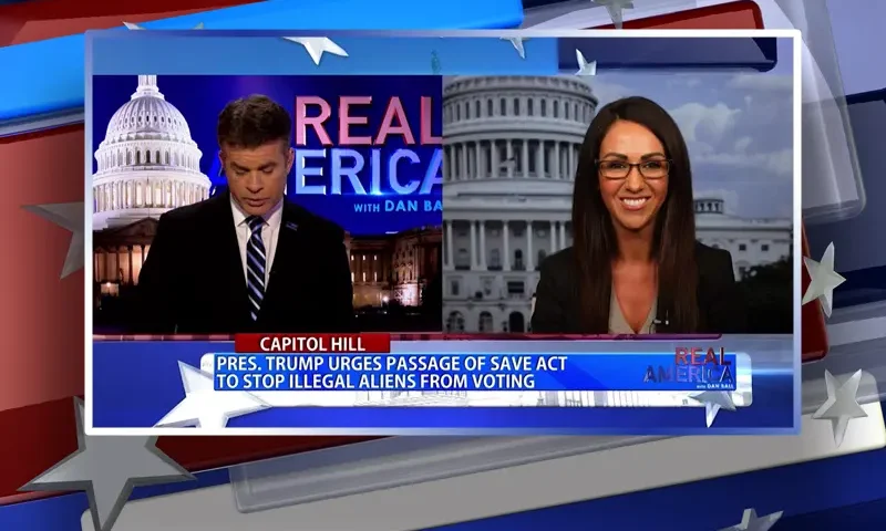 Video still from Real America on One America News Network showing a split screen of the host on the left side, and on the right side is the guest, Lauren Boebert.