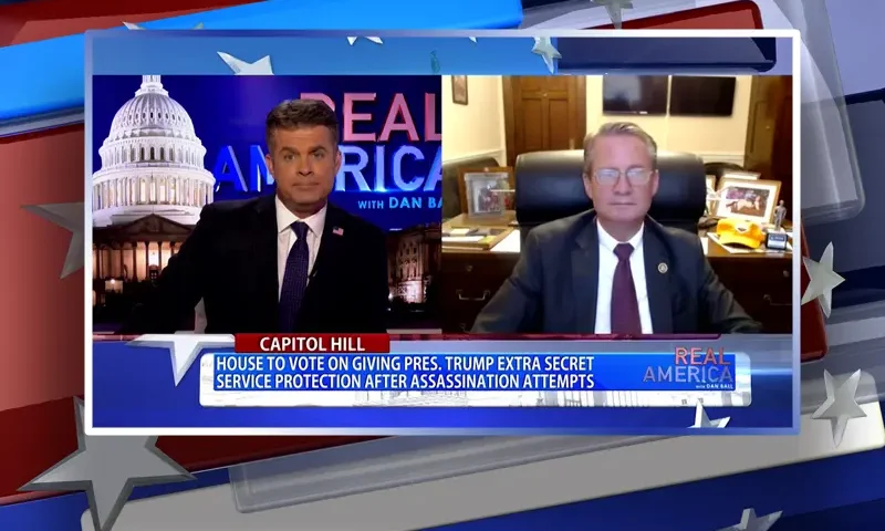Video still from Real America on One America News Network showing a split screen of the host on the left side, and on the right side is the guest, Rep. Tim Burchett.