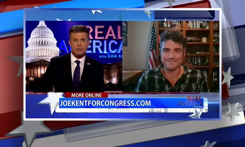 Video still from Real America on One America News Network showing a split screen of the host on the left side, and on the right side is the guest, Joe Kent.