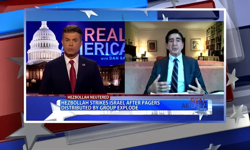 Video still from Real America on One America News Network showing a split screen of the host on the left side, and on the right side is the guest, Harley Lippman.