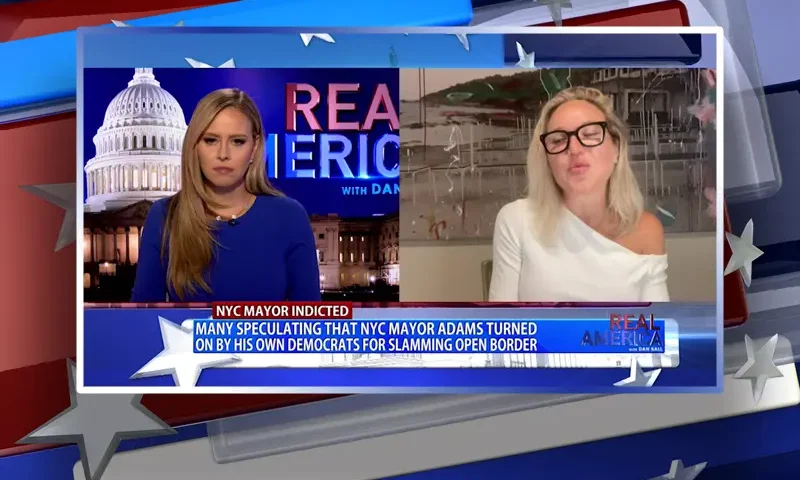 Video still from Real America on One America News Network showing a split screen of the host on the left side, and on the right side is the guest, Jaclyn Toboroff.