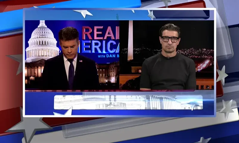 Video still from Real America on One America News Network showing a split screen of the host on the left side, and on the right side is the guest, Jaco Booyens.