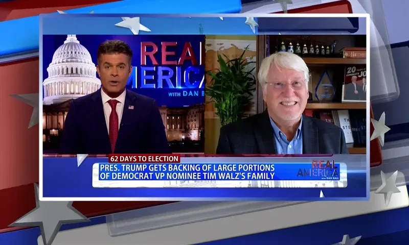 Video still from Real America on One America News Network showing a split screen of the host on the left side, and on the right side is the guest, Joe Hoft.
