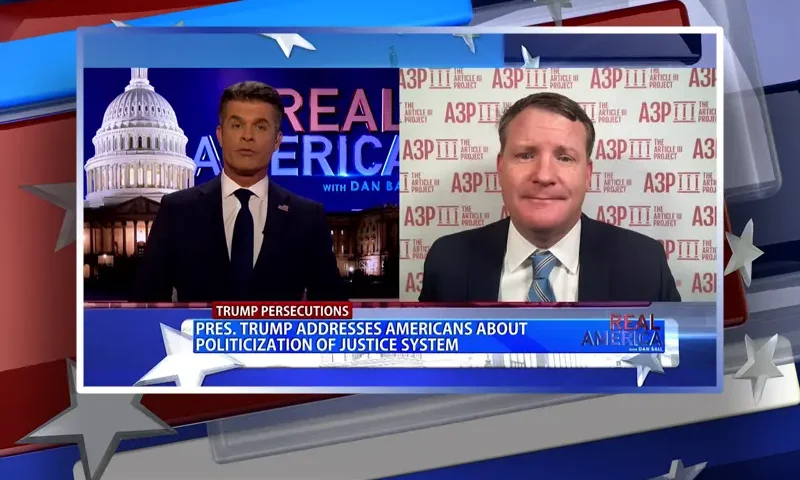 Video still from Real America on One America News Network showing a split screen of the host on the left side, and on the right side is the guest, Mike Davis.