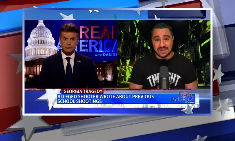 Video still from Real America on One America News Network showing a split screen of the host on the left side, and on the right side is the guest, Drew Hernandez.