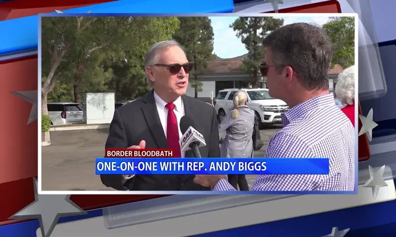 Video still from Real America on One America News Network during an interview with the guest, Rep. Andy Biggs.